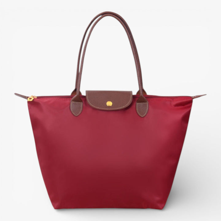 Versatile women's luxury shoulder bag, spacious for work or casual, elegant design, and secure zip closure.