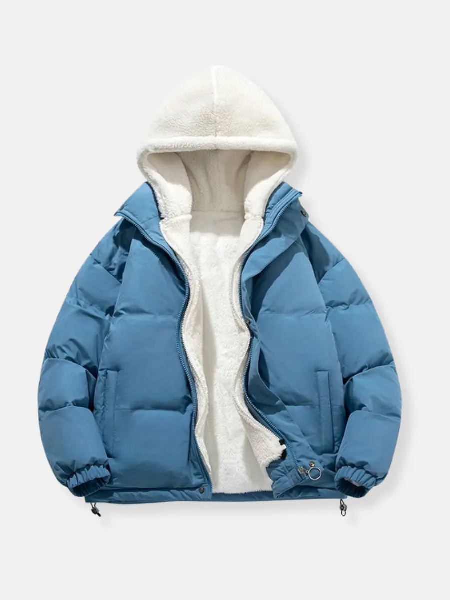 Stylish women's hooded winter coat, padded for warmth, ideal for urban or travel.