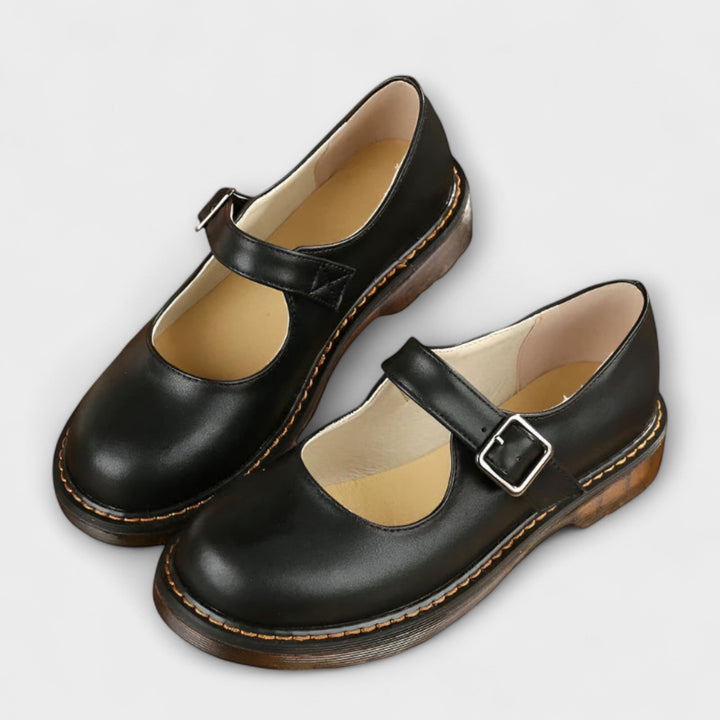 Classic women's Mary Jane flats, comfortable and stylish with a vintage-inspired buckle, ideal for versatile wear.