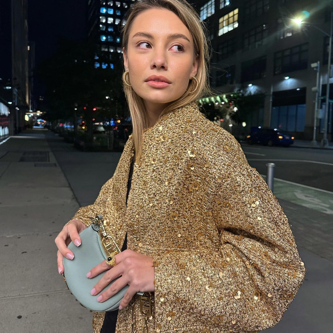 Chic metallic women's jacket with an elegant tailored fit. Ideal mid-season outerwear for versatile fashion.
