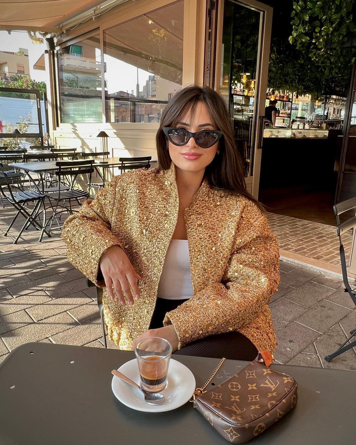 Versatile mid-season women's metallic jacket, tailored for an elegant and fashionable look in spring or autumn.