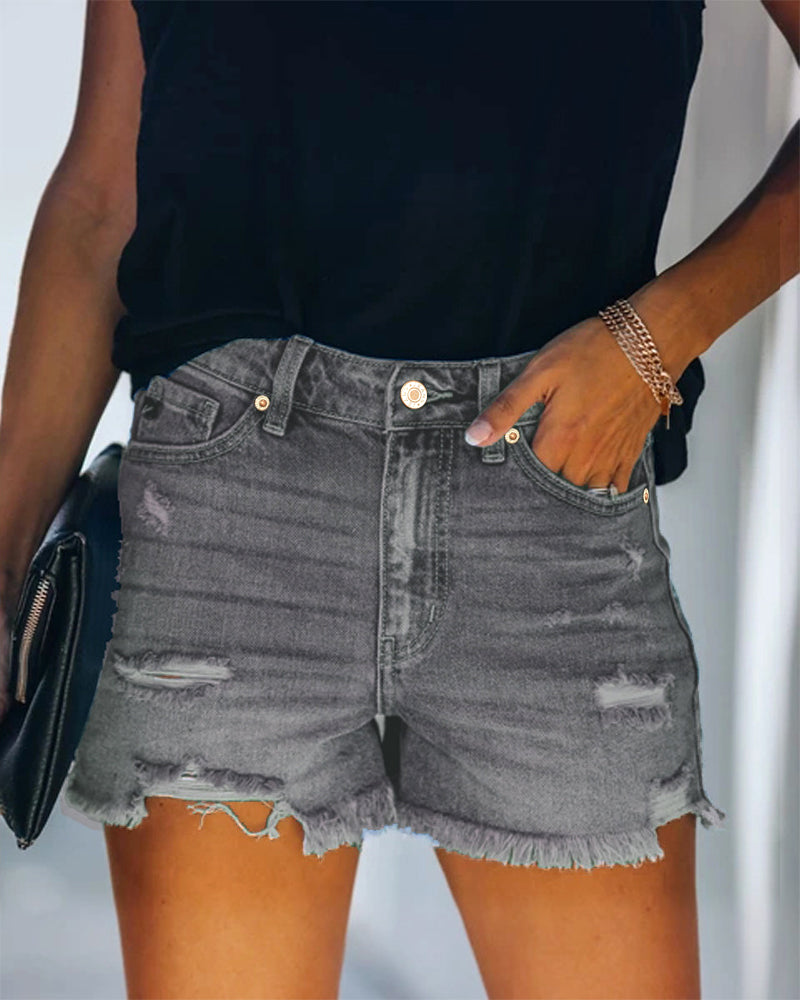 Trendy blue mid-rise distressed denim shorts for women, versatile for summer casual style.