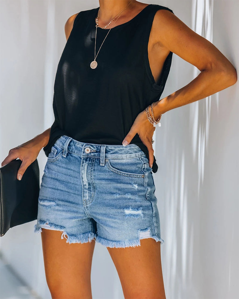 Chic black mid-rise distressed denim shorts for women, perfect for versatile summer casual wear.