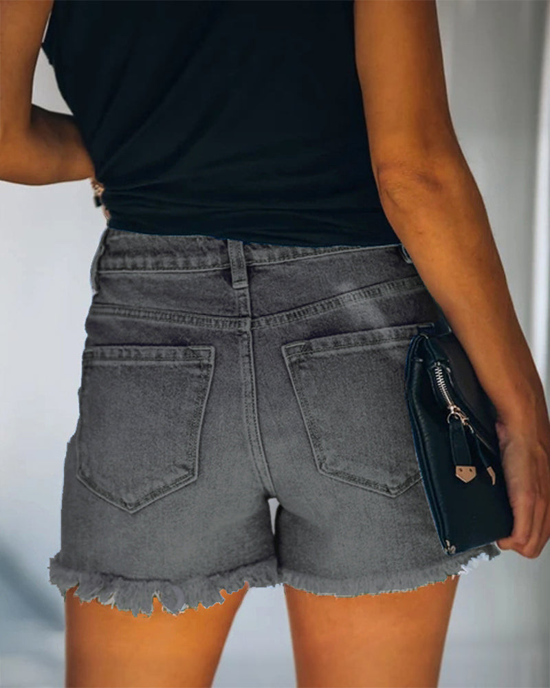 Women's distressed denim shorts with a mid-rise fit, great for trendy summer everyday style.