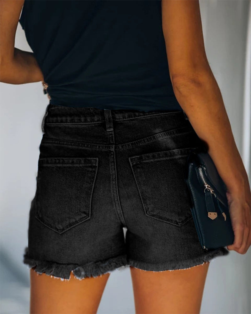 Versatile women's mid-rise distressed denim shorts, ideal for comfortable summer casual activities.