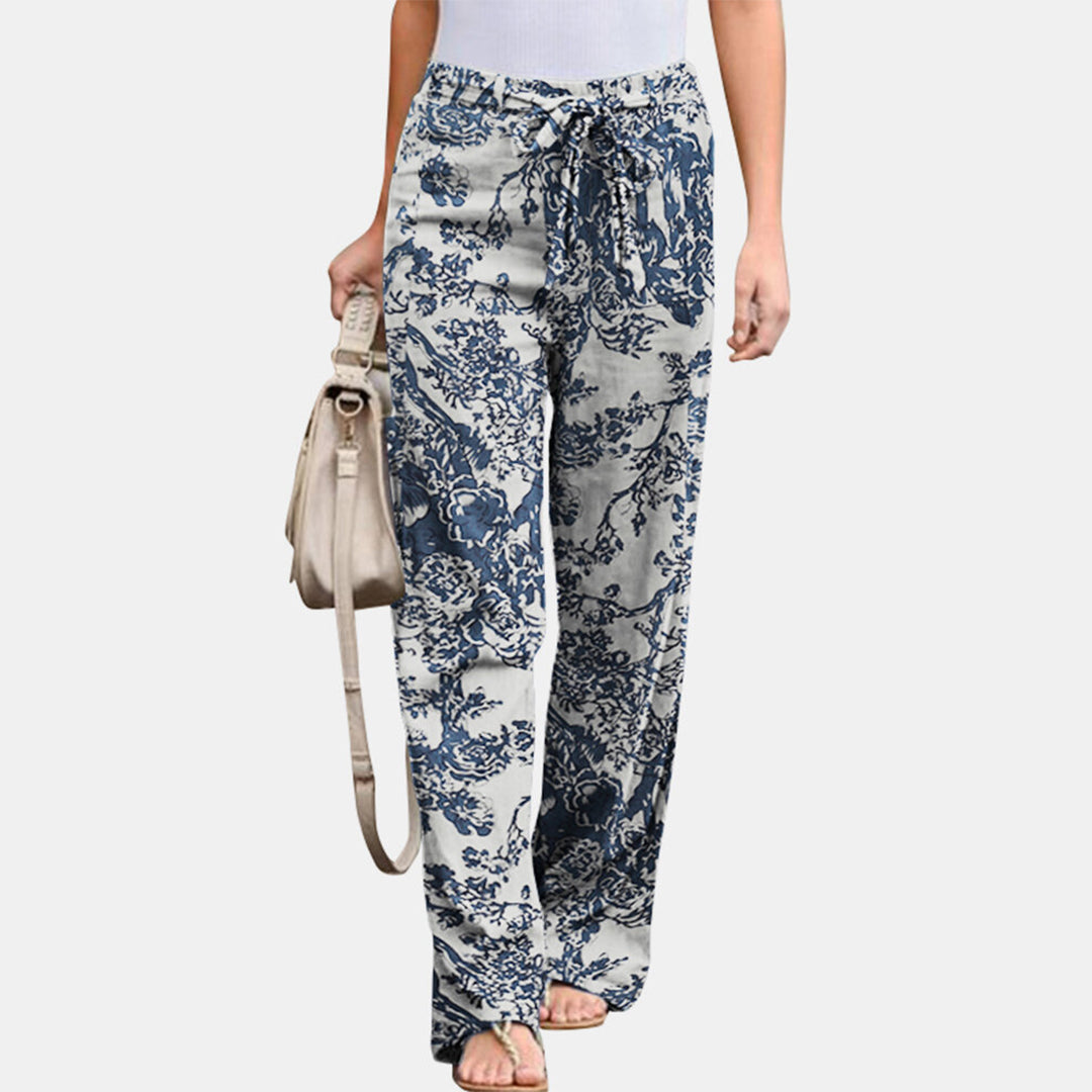 Loose fit women's mid-waist trousers, combining comfortable feel with a versatile & stylish look.
