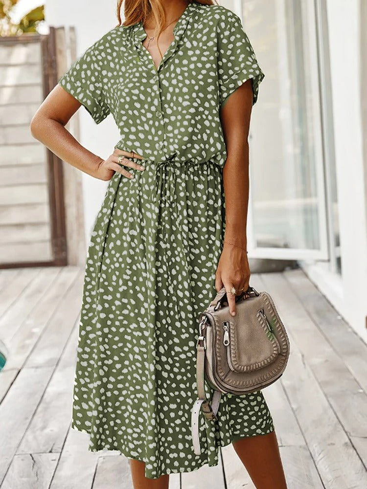 Elegant women's printed midi dress, short sleeve & adjustable waist, ideal for summer fashion.