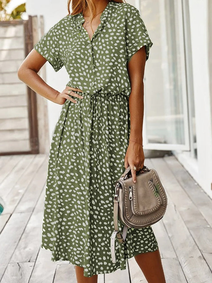 Elegant women's printed midi dress, short sleeve & adjustable waist, ideal for summer fashion.