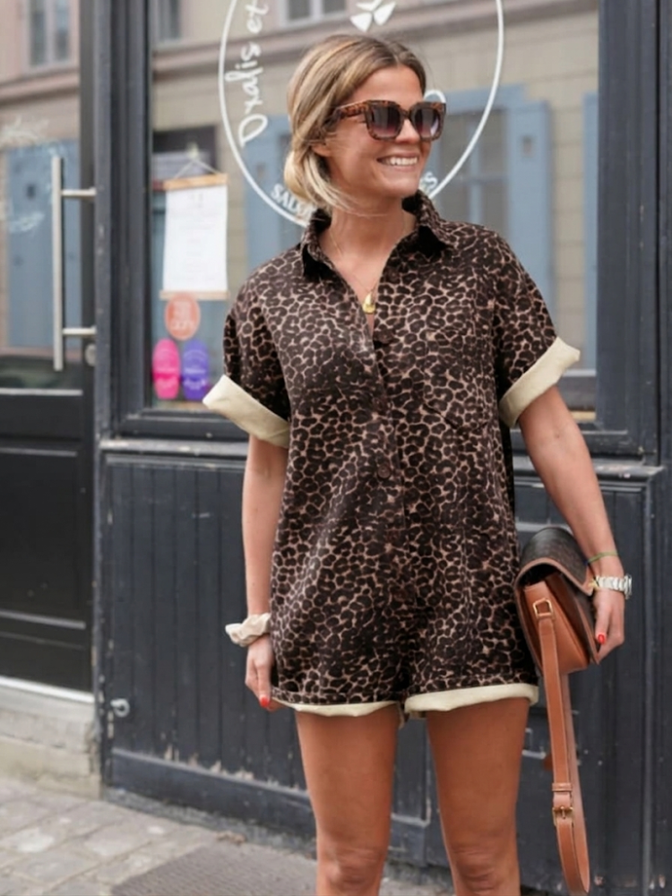 Stylish women's brown cheetah print mini romper. Ideal trendy resort wear or vacation outfit.