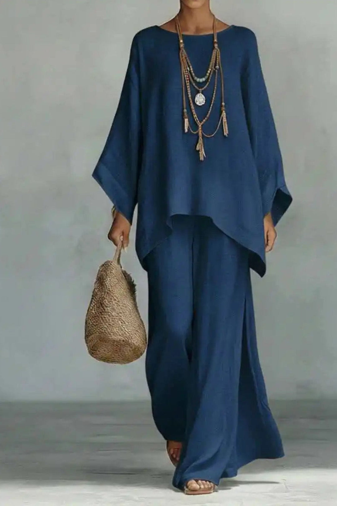 Women's versatile minimalist co-ord set featuring a batwing top and wide-leg pants, perfect for summer outfits.