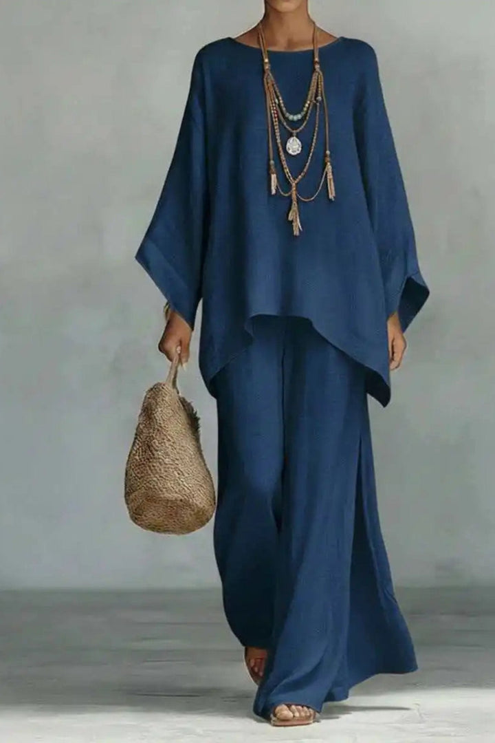 Women's versatile minimalist co-ord set featuring a batwing top and wide-leg pants, perfect for summer outfits.