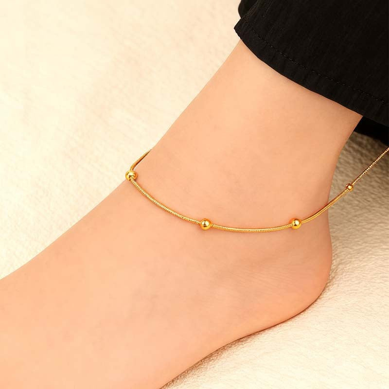 Elegant women's gold tone minimalist charm jewelry. Perfect for layering as a necklace, bracelet or anklet.