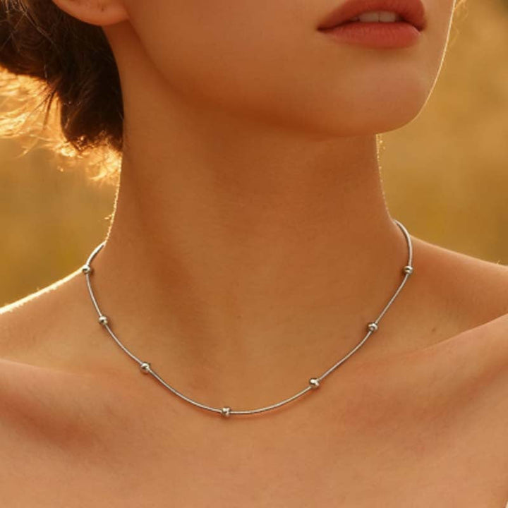 Women's delicate charm bracelet, anklet, or necklace in silver tone. Perfect minimalist fashion.
