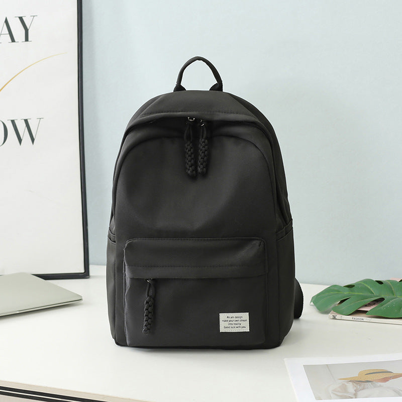 Functional women's everyday backpack for travel, work, or college. Features a sleek, minimalist design & storage.