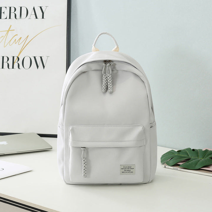 Black minimalist women's fashion backpack, ideal as a daily work bag or stylish college carry-all for essentials.