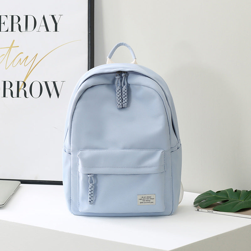 Chic minimalist women's backpack for daily essentials. Functional and fashionable for work, travel, or school.