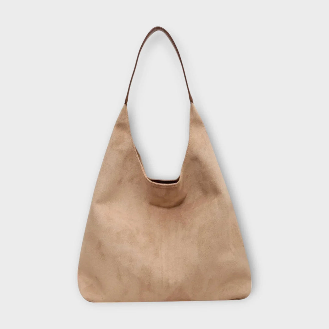 Effortless women's hobo shoulder bag in a timeless minimalist design. Versatile everyday handbag.