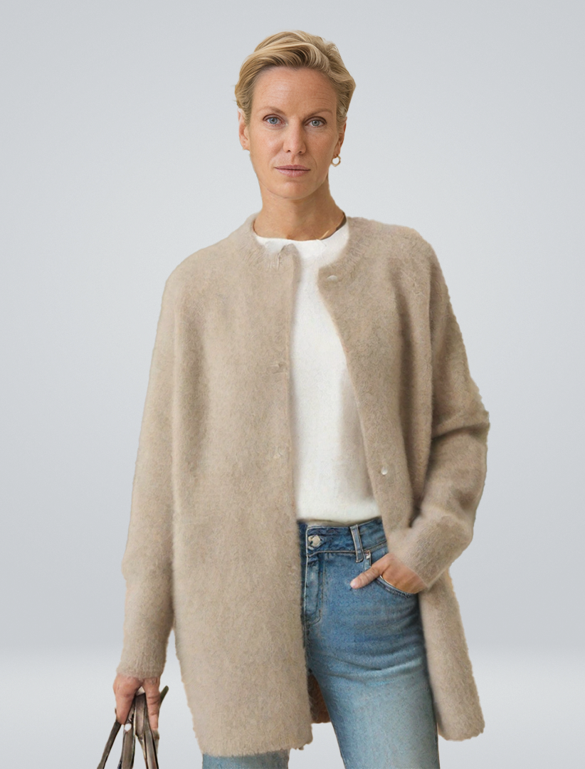 Women's minimalist longline button cardigan, perfect for elegant layering in autumn style.