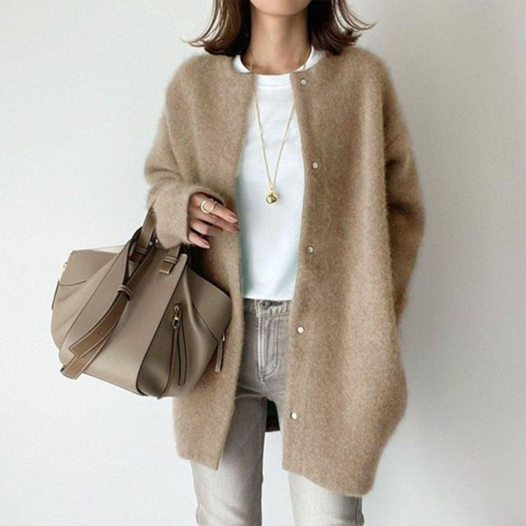 Relaxed fit women's longline button cardigan in a minimalist style, offering everyday comfort.