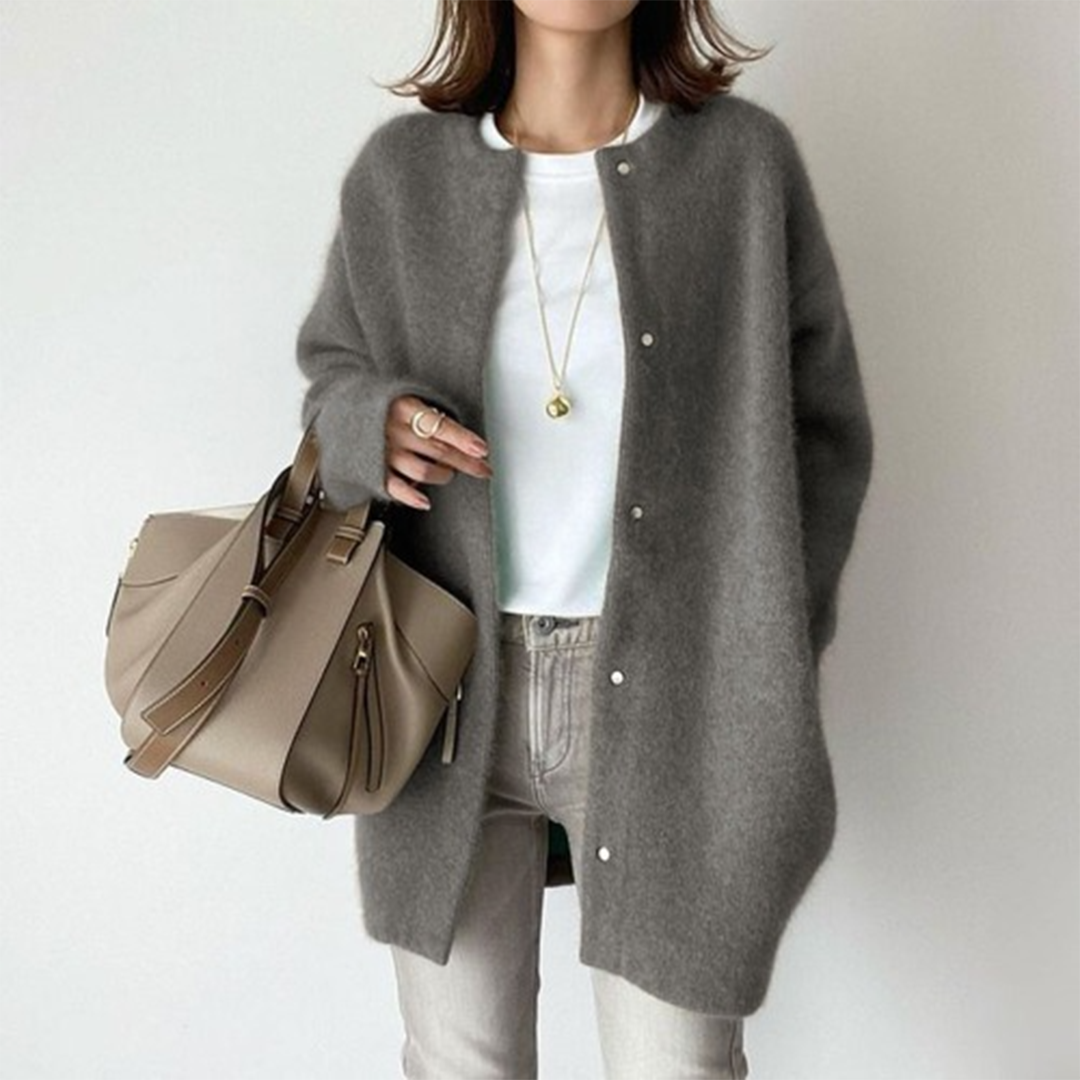 Neutral toned women's longline button cardigan. Minimalist style, ideal for sophisticated layering.