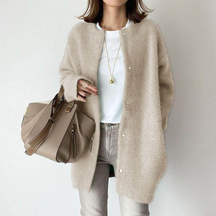 Comfortable women's minimalist longline button cardigan, ideal for relaxed everyday fashion.