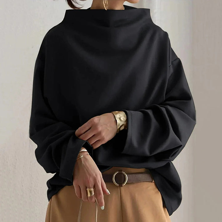 Elegant women's loose-fit top, comfortable and versatile for modern everyday fashion. Simple, chic design.