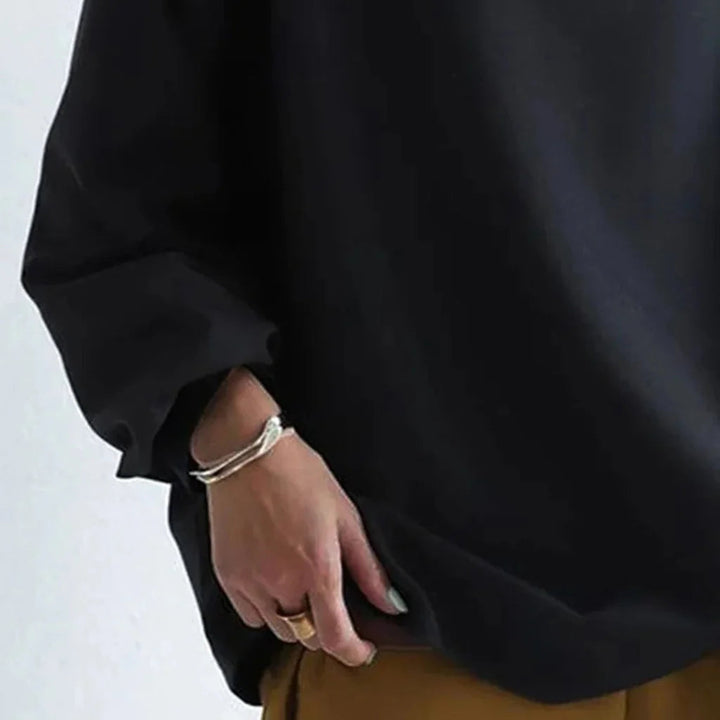 Versatile loose-fit top for women, ideal for casual wear and everyday comfort. Simple minimalist design.