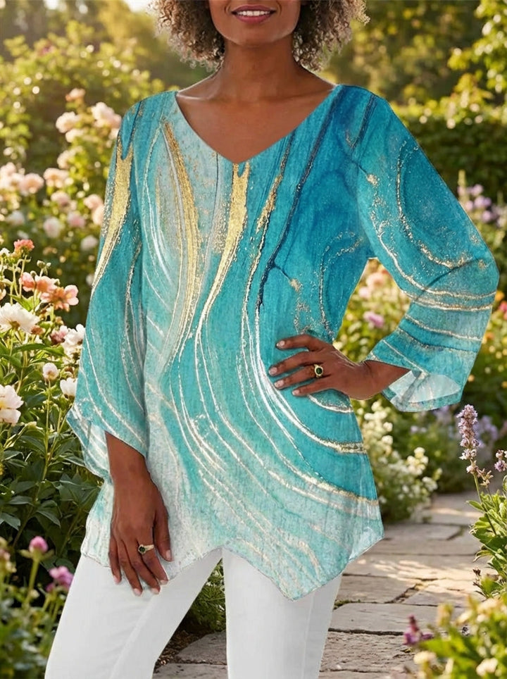 Statement women's fashion top: unique marble print, asymmetric hem, short batwing sleeves, stylish loose fit.