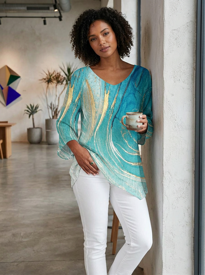 Minimalist women's short sleeve top with marble print, V-neck, and asymmetric hem; a comfortable loose fit.