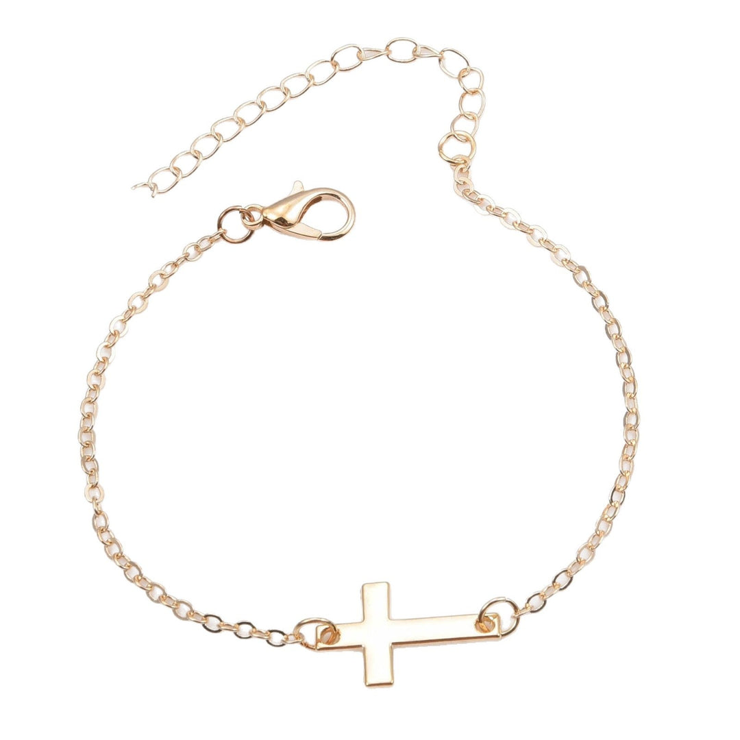 Delicate silver charm bracelet with a minimalist cross, spiritual jewelry for women, elegant & adjustable.