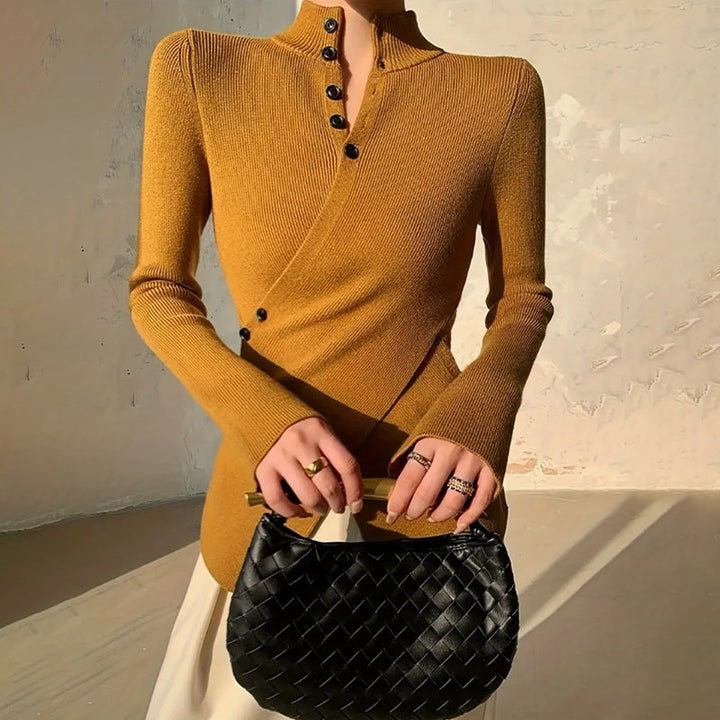 Chic women's mock neck wrap sweater with asymmetrical hem and stylish button detail. Perfect fall fashion.