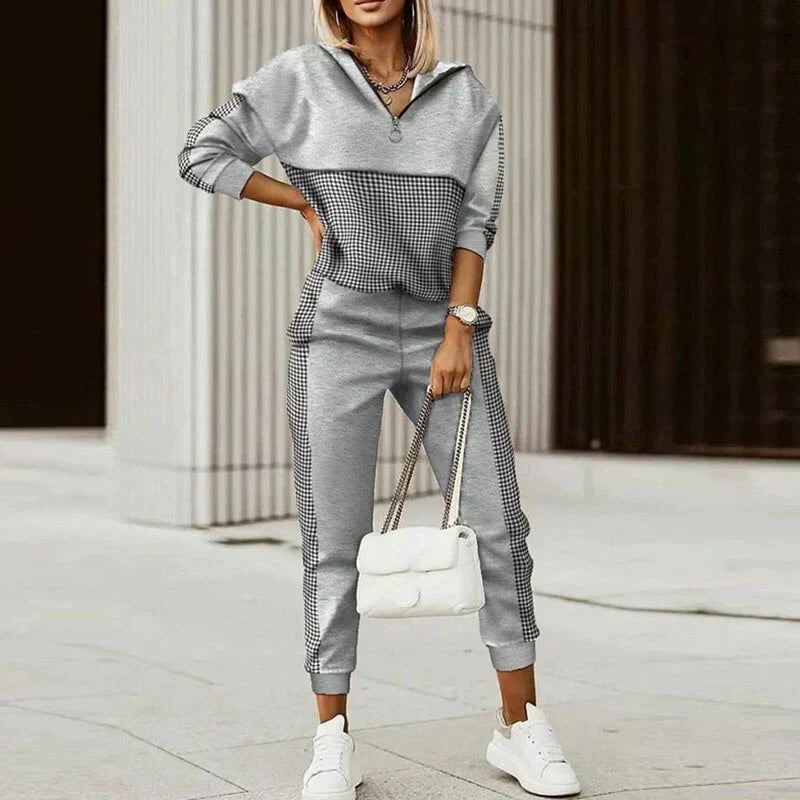 Comfortable women's modern tracksuit, a stylish two-piece set with a zippered top for casual & active wear.
