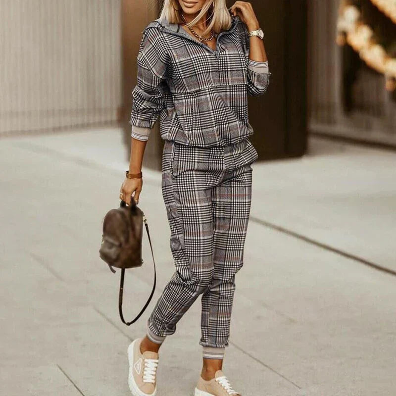 Full view of women's modern casual tracksuit set, featuring a zipper top & comfortable bottoms. Perfect for everyday.