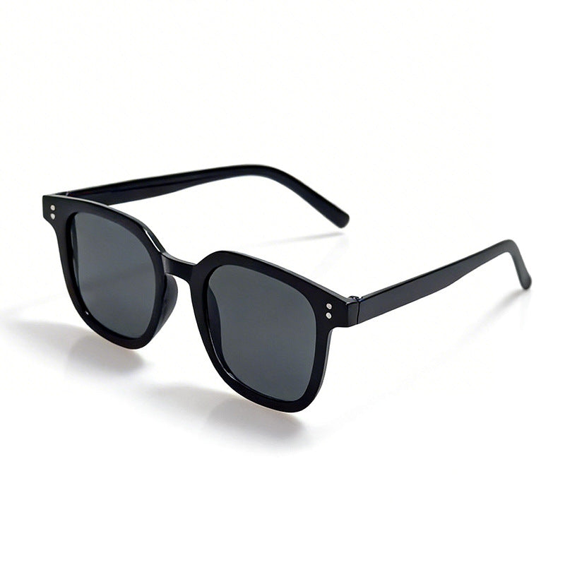 Modern oversized square sunglasses for women, a stylish black fashion accessory for a chic look.