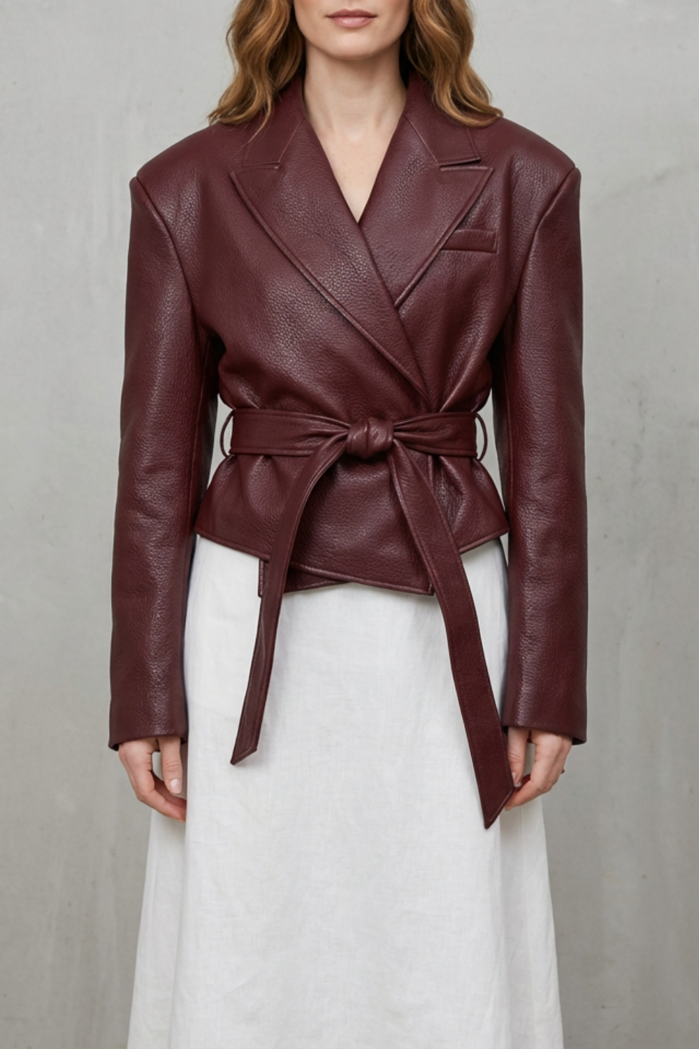 Women's modern sculpted belted jacket, elegant and stylish, perfect for versatile outerwear.