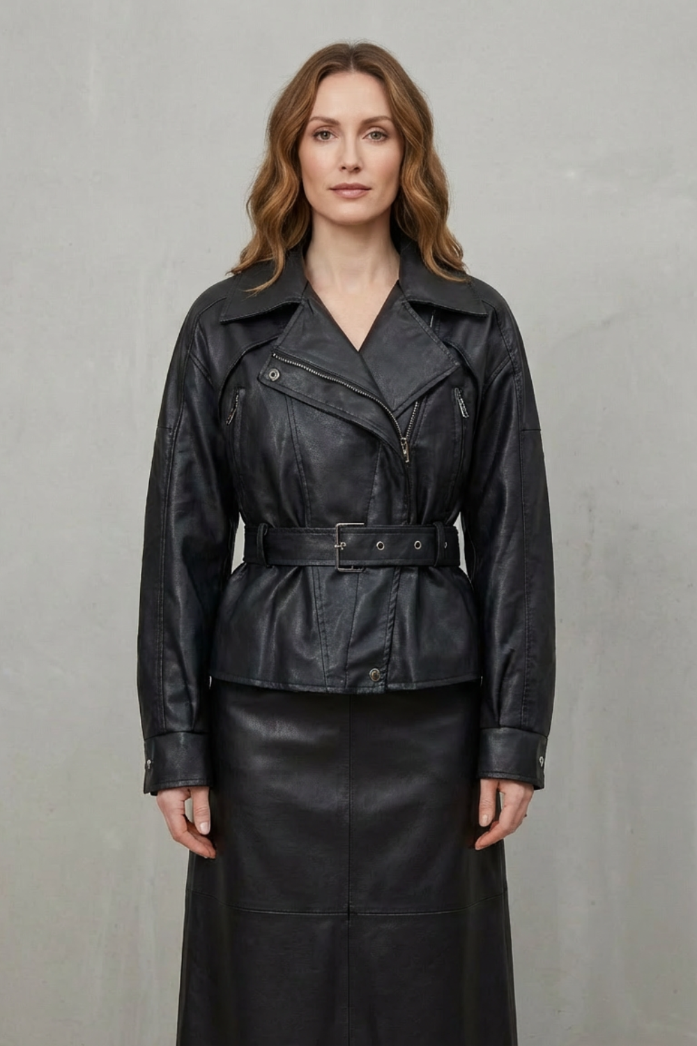 Women wearing a modern sculpted belted jacket, a versatile and elegant piece for contemporary fashion.