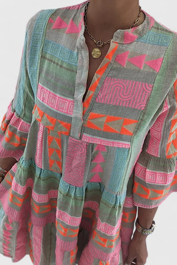Comfortable women's bohemian tiered swing dress. Flowy design, ideal as a casual summer or vacation dress.