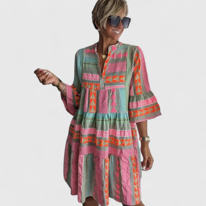 Stylish women's boho tiered dress. Multi-color, comfortable, and flowy, great for summer, casual, or vacation.