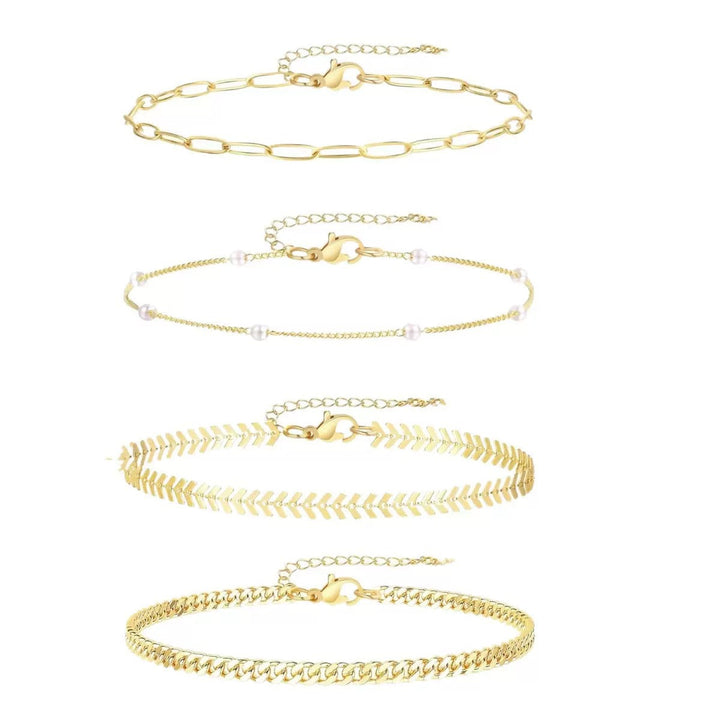 Dainty multi-layered ankle bracelets in gold & silver tones, a versatile women's fashion accessory set.