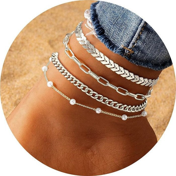 Chic multi-layer chain anklet set for women, ideal as a versatile fashion accessory with pearl accents.