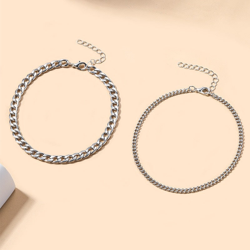 Elegant silver and gold multi-layered chain necklace for women. Fashionable statement jewelry.