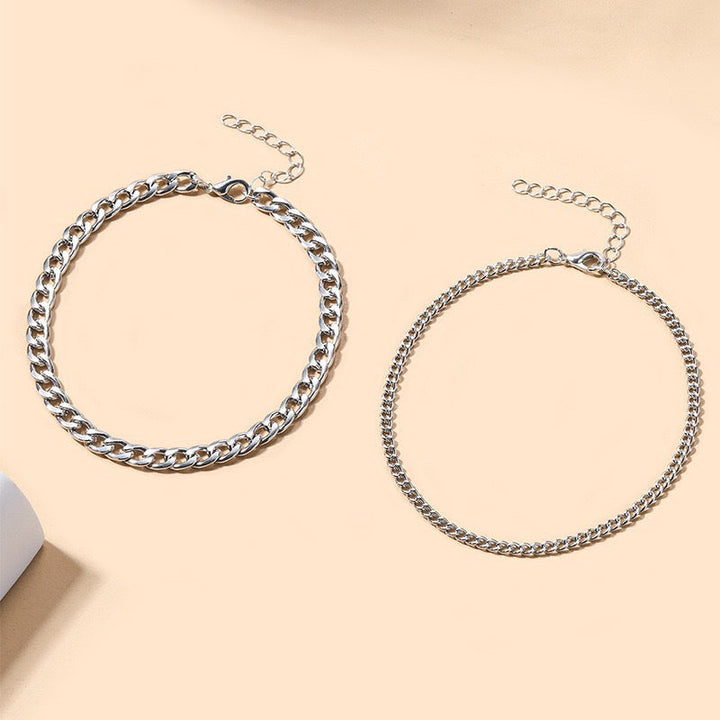 Elegant silver and gold multi-layered chain necklace for women. Fashionable statement jewelry.