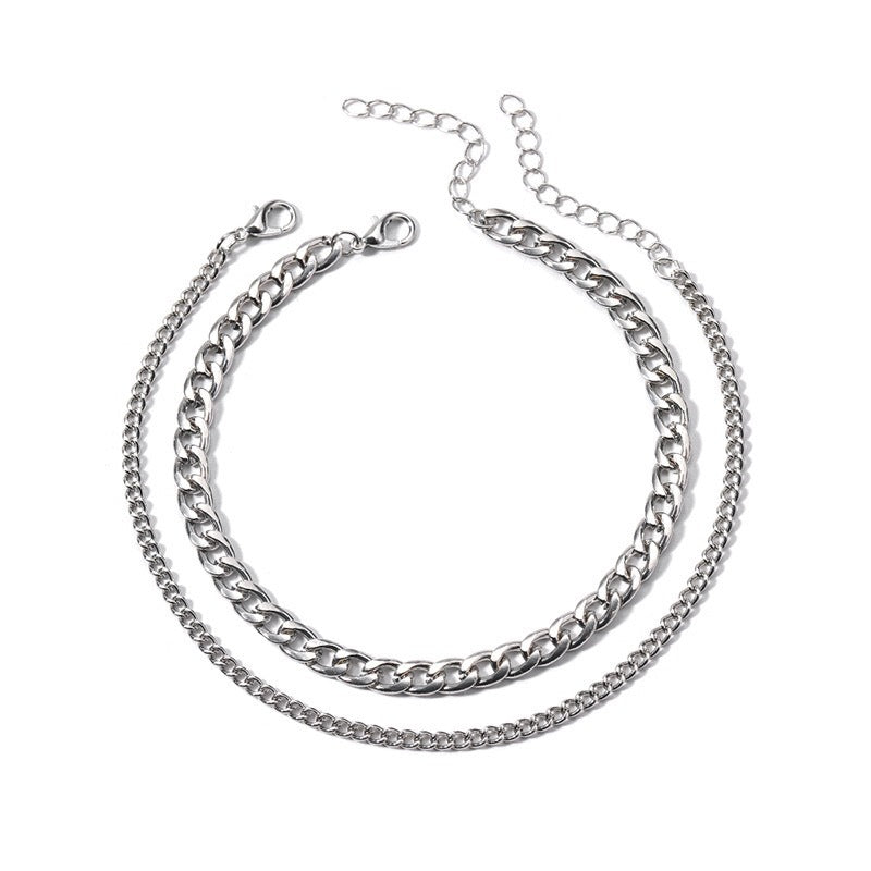 Chic women's silver & gold layered chain necklace. Fashion jewelry for an elegant, modern look.