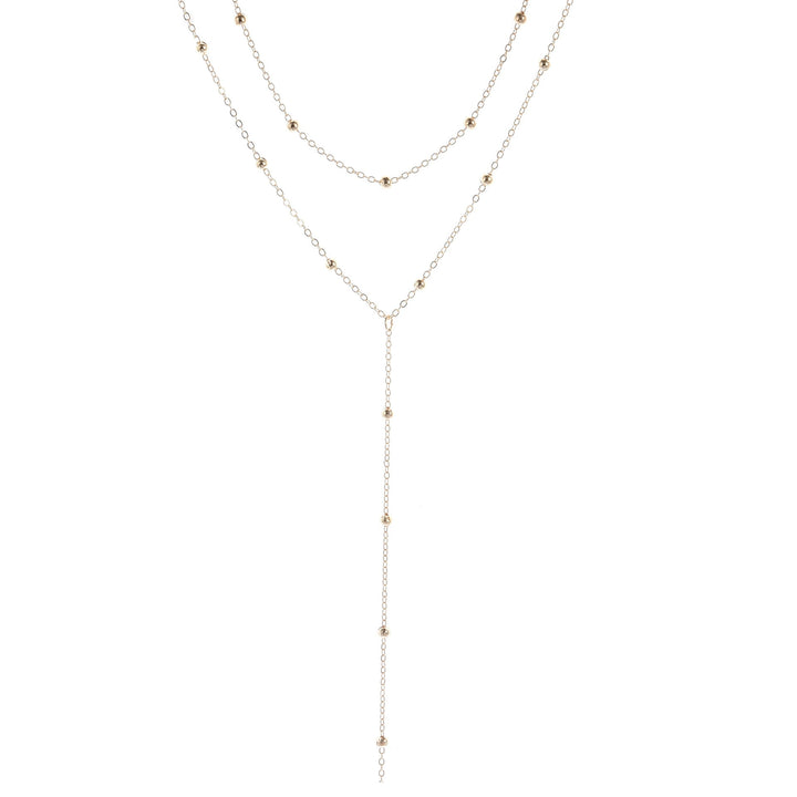 Chic multi-layered gold lariat charm necklace, a delicate yet striking accessory for women's fashion.