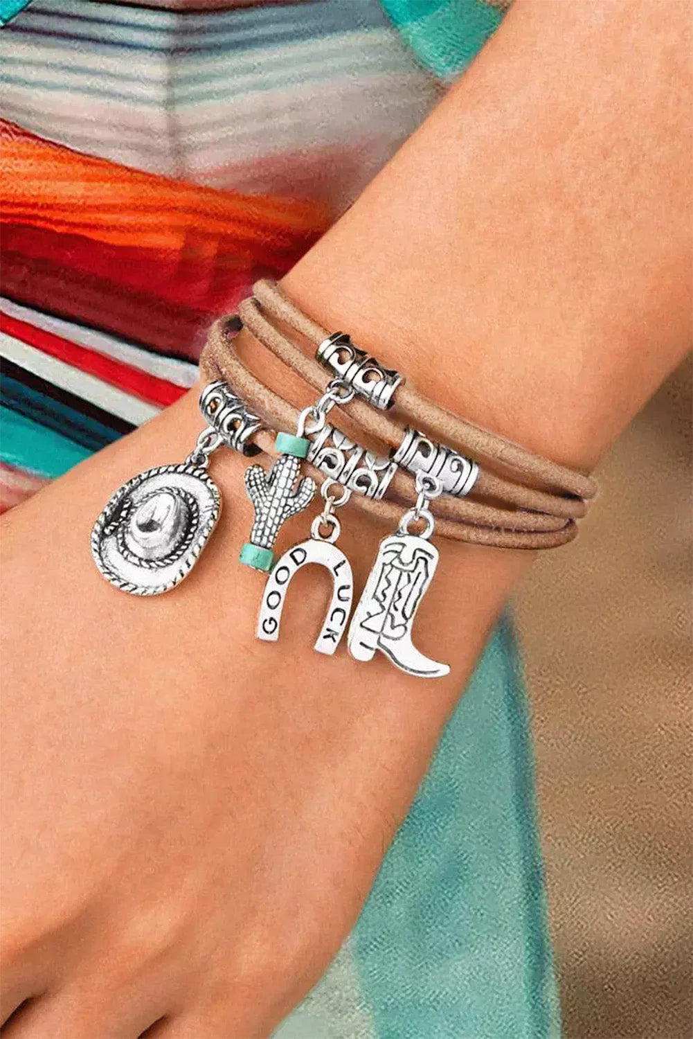 Women's multi-layered silver western charm bracelet with hat, boot, and cactus charms. Bohemian style jewelry.