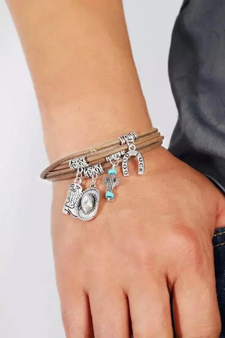 Bohemian women's multi-layered silver charm bracelet featuring western hat, boot, and cactus accents.