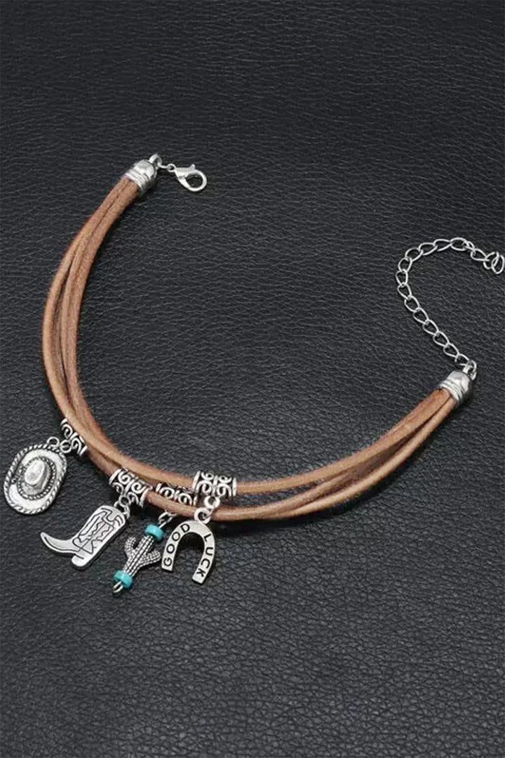 Stylish women's multi-layered western charm bracelet. Silver tone with hat, boot, and cactus elements.