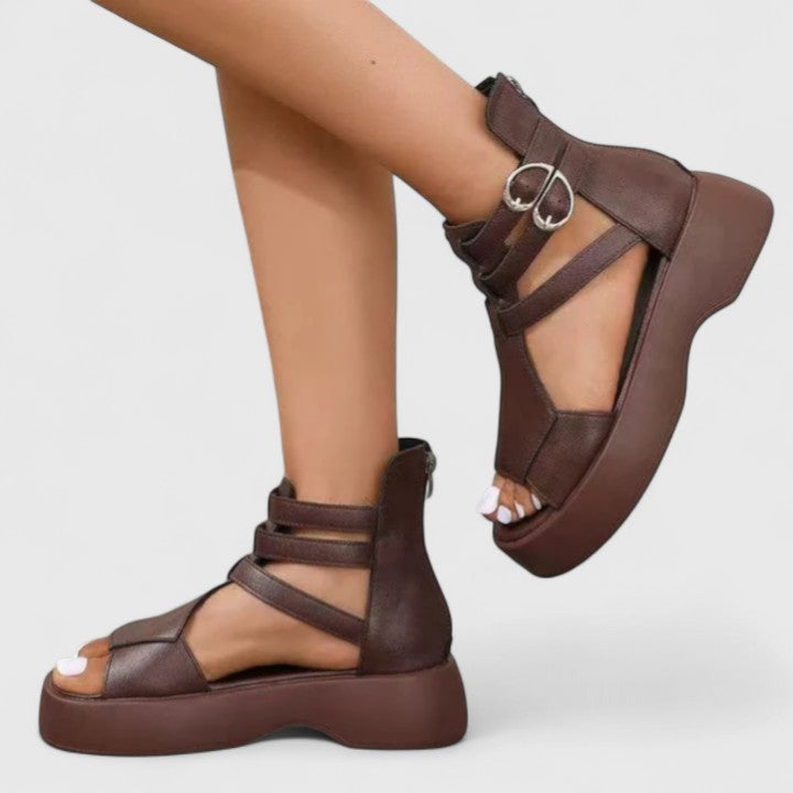 Fashionable women's platform sandals with multiple straps and a distinctive chunky sole for modern design.