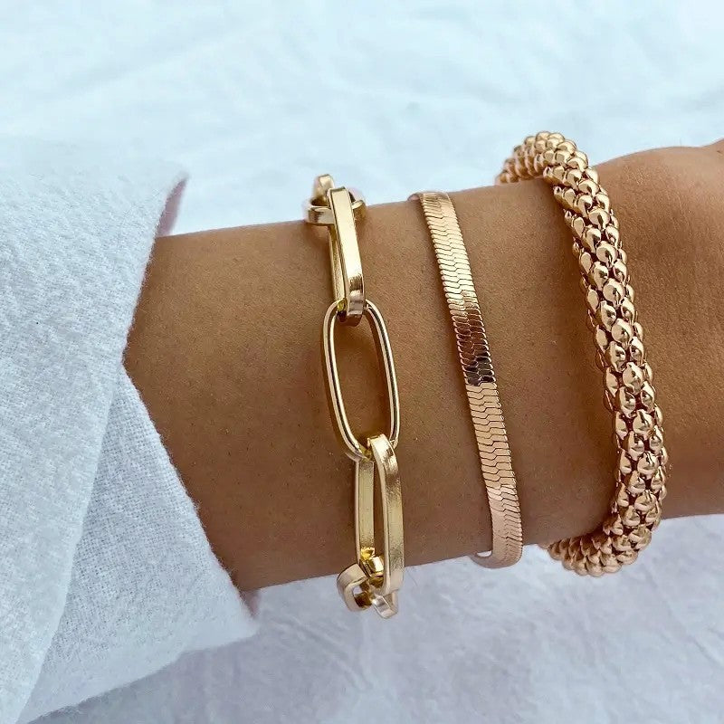 Women's multi-textured chain bracelet set, adjustable, featuring gold & silver tone links.