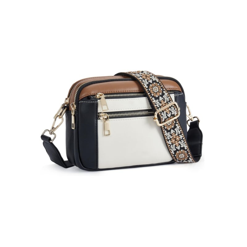 Modern women's crossbody bag with multiple zippers and a stylish printed strap, combining utility and trendy design.